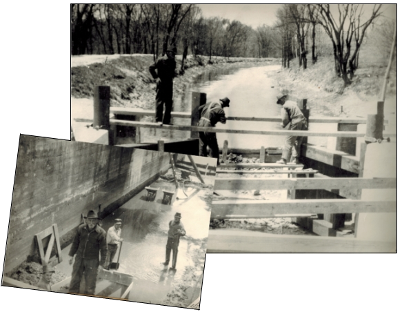 William McLaughlin, 79 years old at the time (wearing the dark jacket and fedora), oversees lock restoration in 1938
